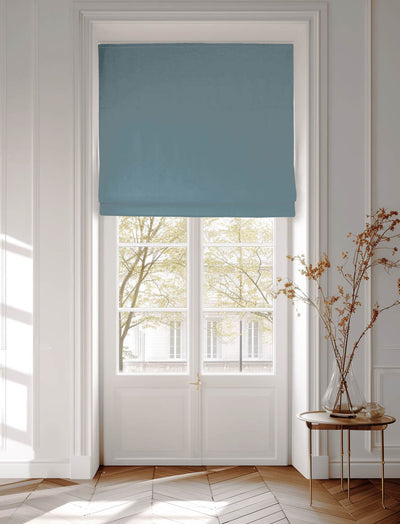 Blue Cotton Blind covering a window in urban setting