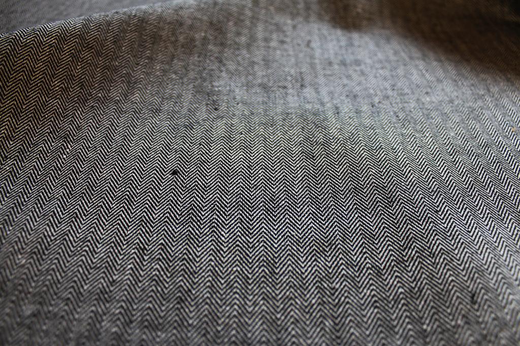 Edda Noir - Black and white Herringbone fabric for curtains, close-up