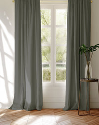 Greige 100% Cotton curtains covering a window looking into the garden