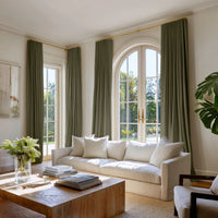 Living room with two pairs of green curtains