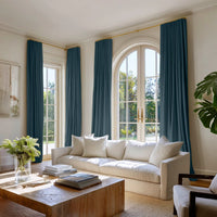 Blue Cotton curtains made of Amara Marine Blue fabric. Two pairs of curtains in a stylish living room
