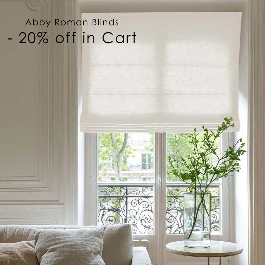 White Abby Roman blinds covering a window in a stylish living room