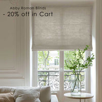 Adria Natural Linen Roman Blind in a nicely decorated living room