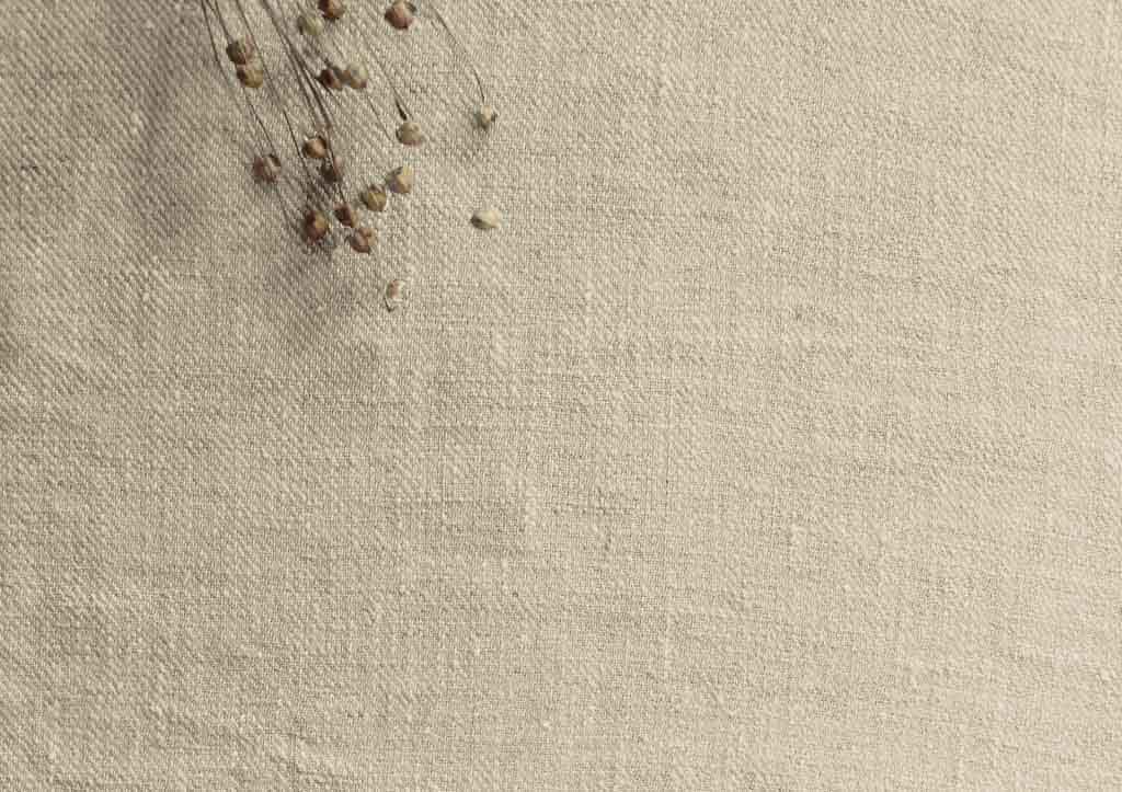 Natural 100% linen fabric - Close-up shot of the material.