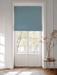Blue Cotton Blind covering a window in urban setting
