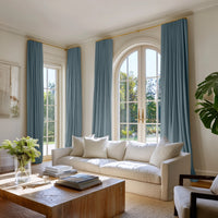 Two pairs of Blue cotton curtains in a contemporary living room setting