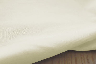 Close-up shot of the structure of the Amara Cream cotton fabric