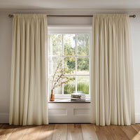 Neutral curtains made of Amara Creamy Mist cotton fabric