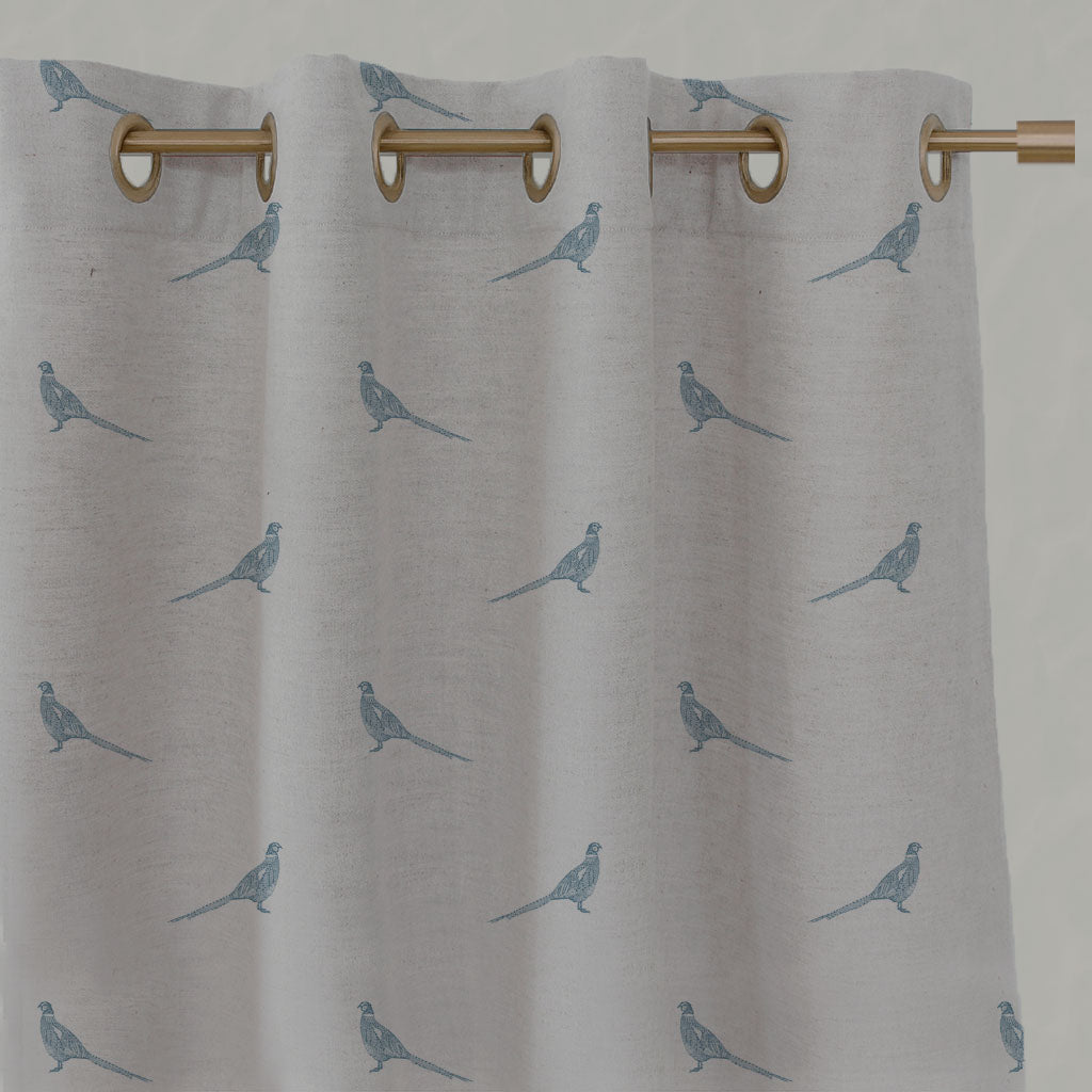 Blue Kids Linen Eyelet Curtains - Pheasant True Blue - Natural base fabric.