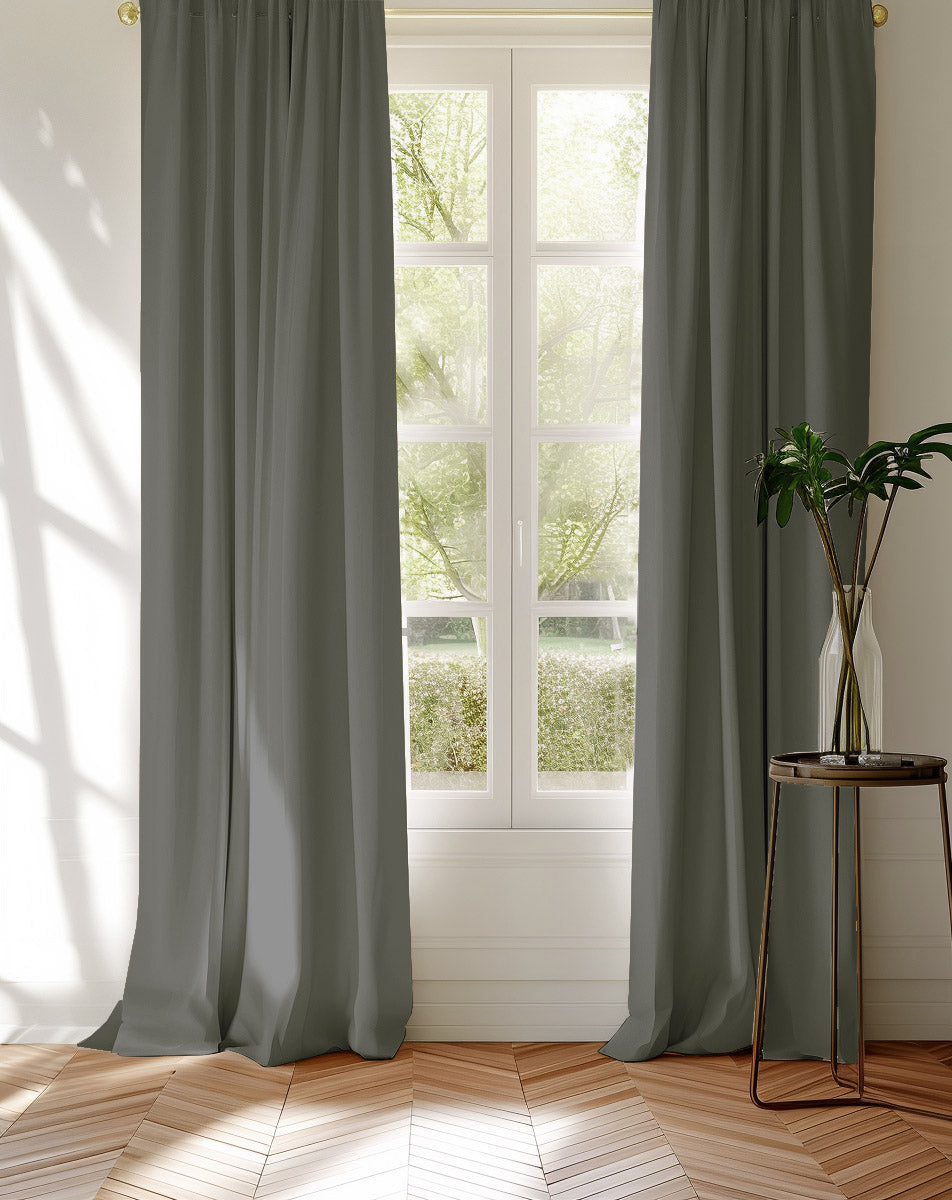 Greige 100% Cotton curtains covering a window looking into the garden