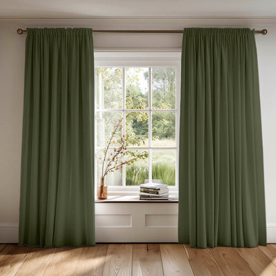 Green cotton curtains made of Amara Magic Pine fabric