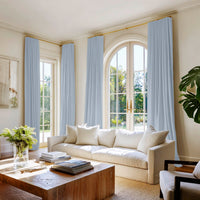 Amara Pale Blue curtains in an elegant living room