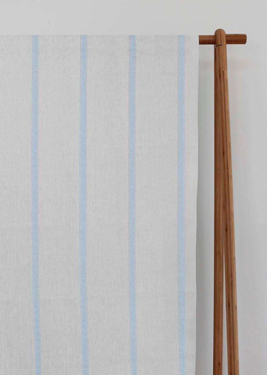 Rune Shadow Blue - vertical blue tone striped fabric.